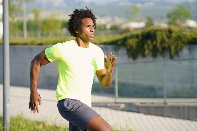 640 black athletic man running in an urban park 1